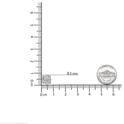 Close-up front angle of a white metal earring with multiple white round gemstones in prong settings, placed on a ruler and next to a coin for size reference.