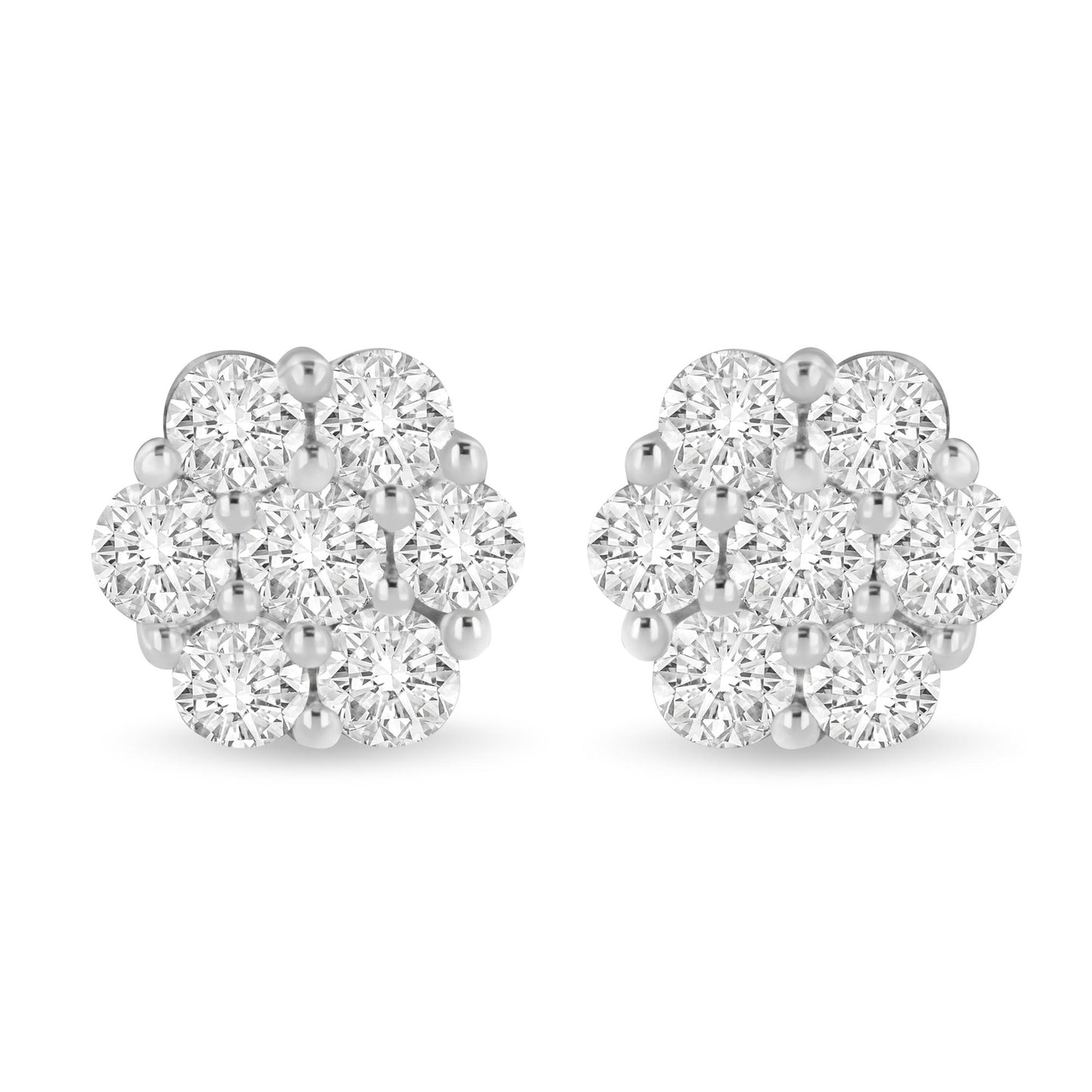 Pair of white metal cluster earrings with round white gemstones in shared prong setting, front view.