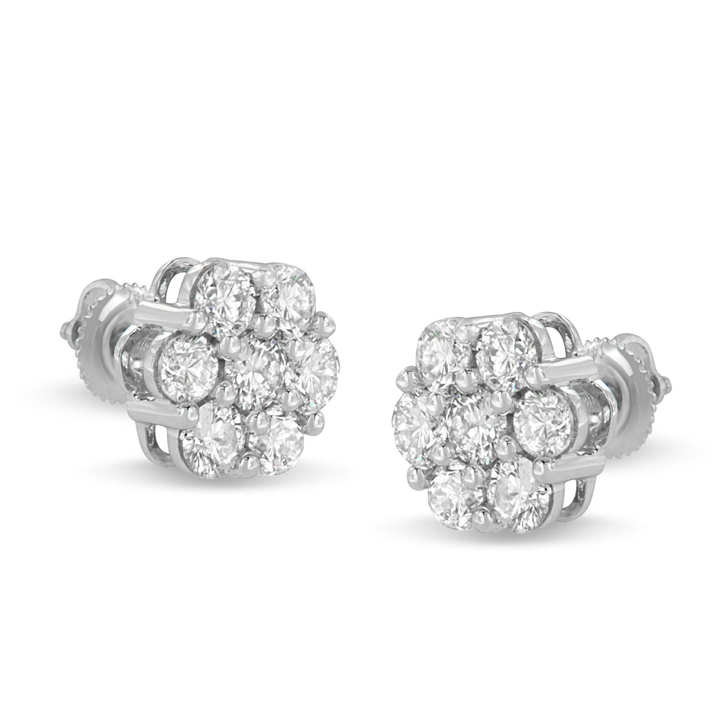 Pair of white metal stud earrings viewed at an angle, each featuring a cluster of round white gemstones in shared prong settings.