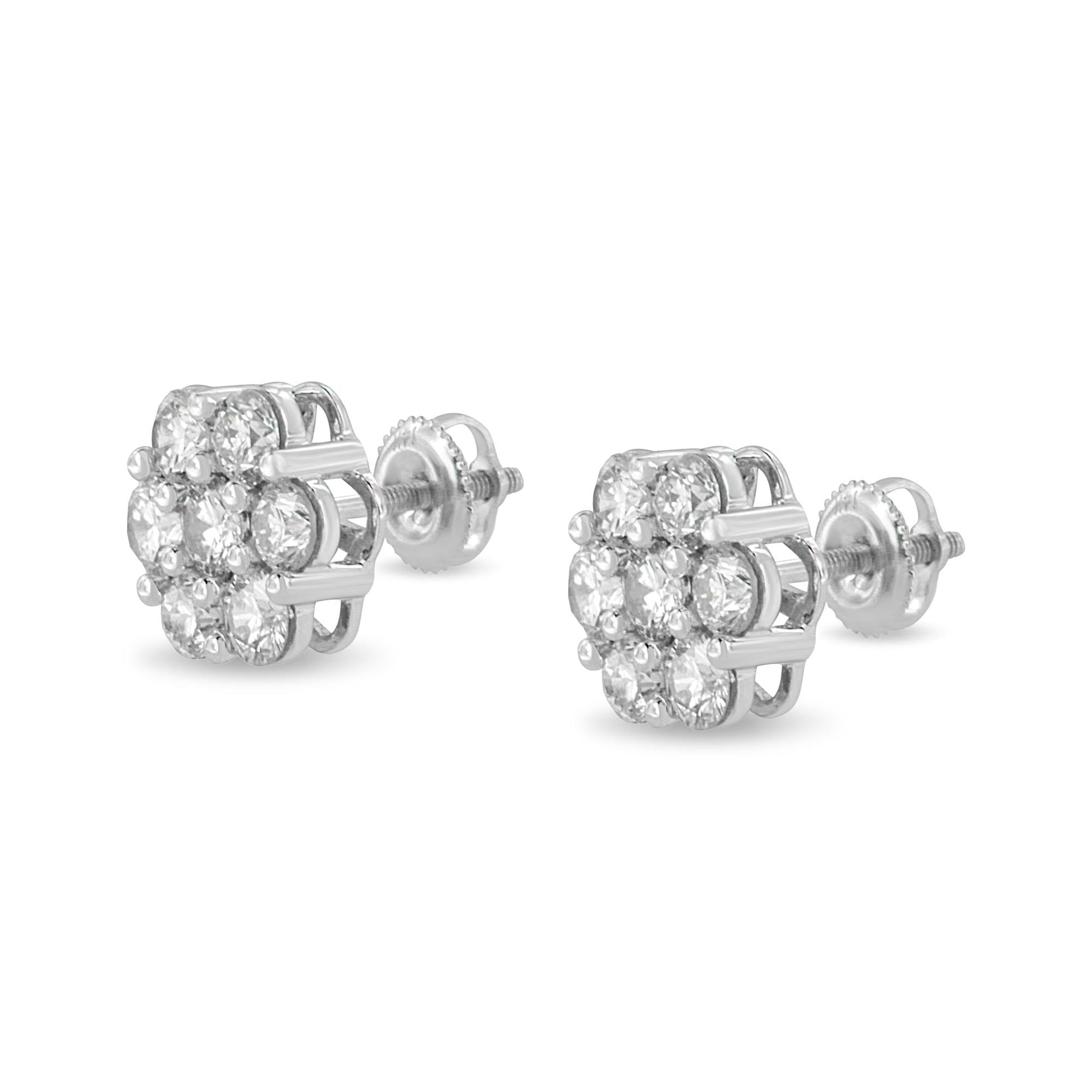 Pair of white metal stud earrings with round white gemstones in a shared prong setting, shown at a slight angle.