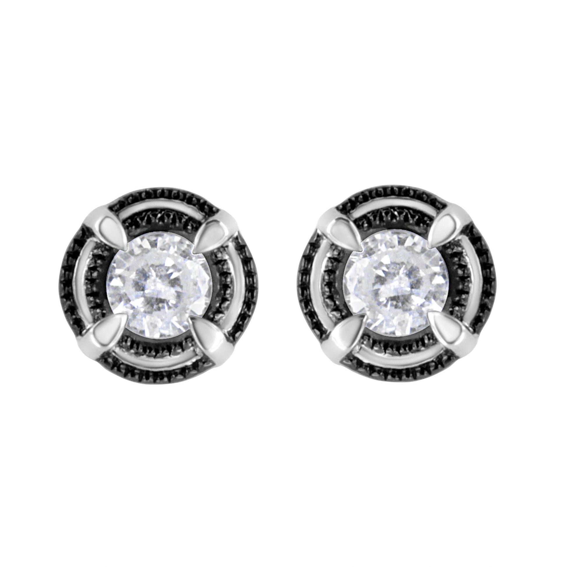 Front view of white metal stud earrings with round white gemstones set in prong settings, surrounded by a circular black textured border.