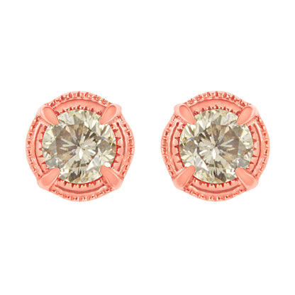 Front view of rose metal stud earrings featuring round brownish gemstones in prong settings.