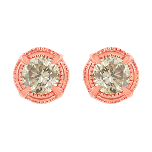 Front view of rose metal stud earrings featuring round brownish gemstones in prong settings.