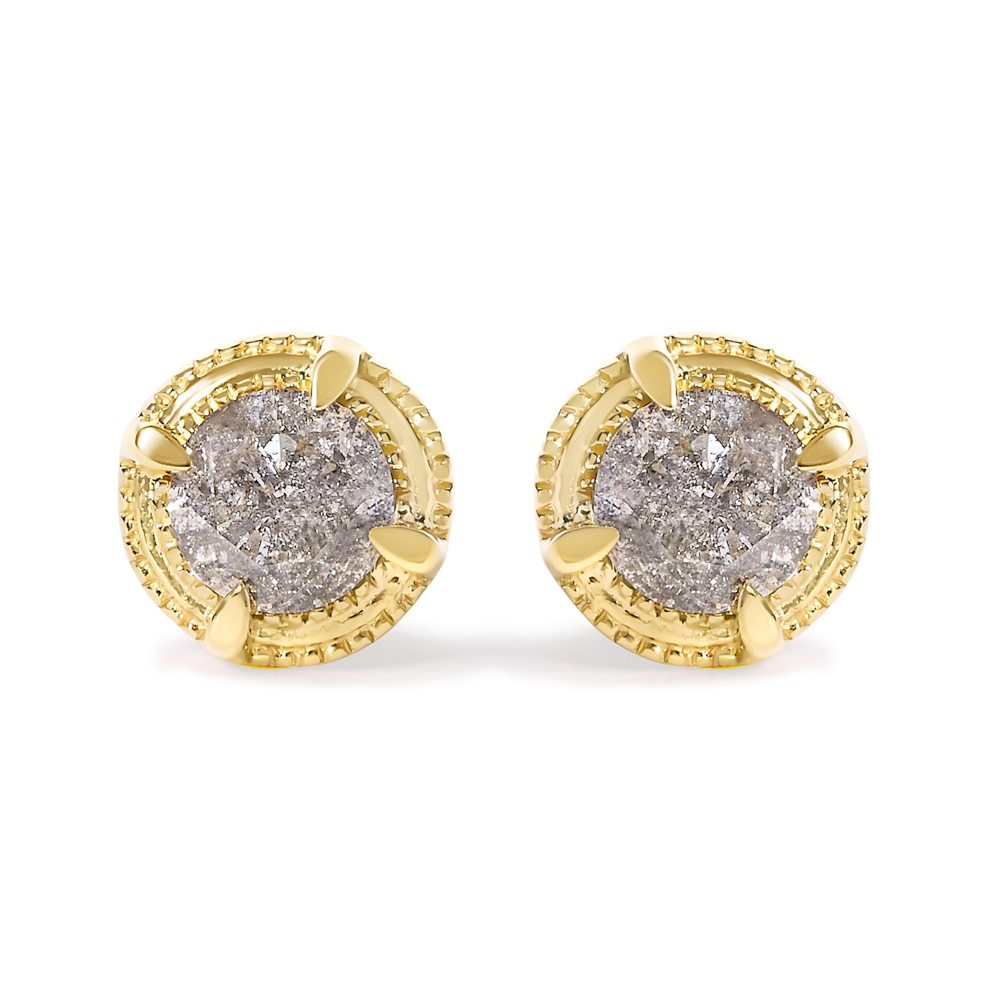 Front angle view of a pair of yellow metal stud earrings each featuring a round brownish gemstone in a prong setting.