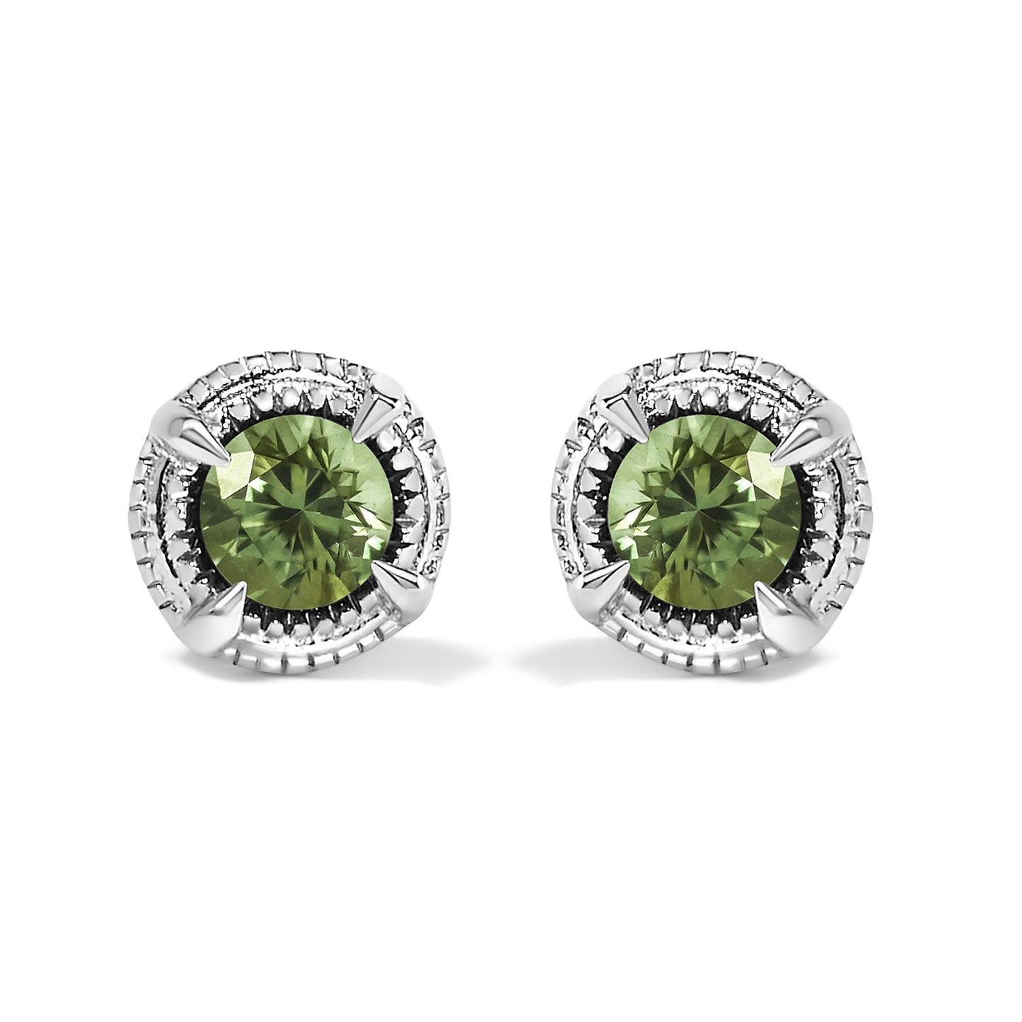 Front-facing shot of a pair of white metal stud earrings, each featuring a round prong-set green gemstone surrounded by a textured circular border.