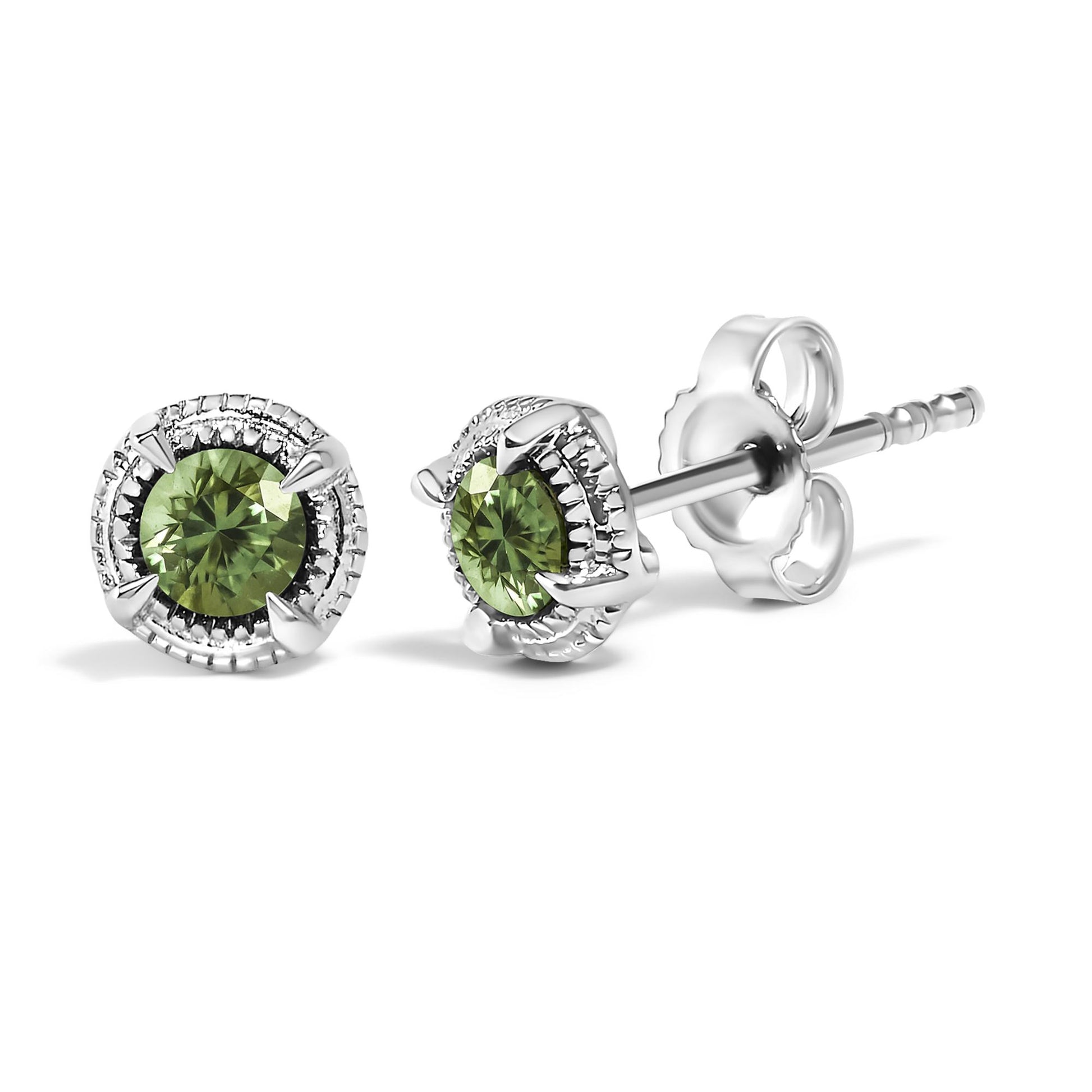 Pair of white metal stud earrings with round green gemstones in prong settings, shown at a slight angle on a white background.