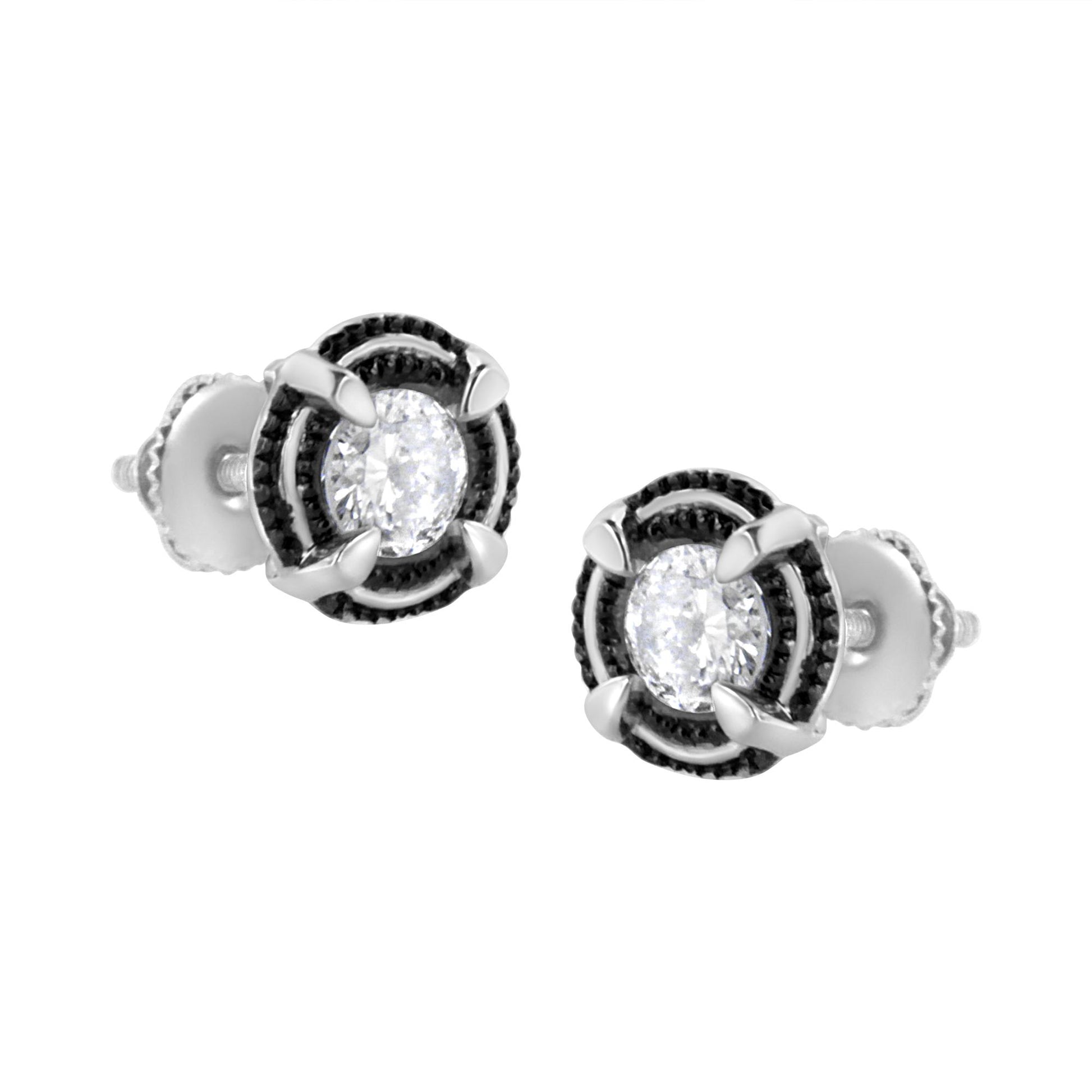 Pair of white metal stud earrings with round white gemstones in prong settings, shown from a front angle.