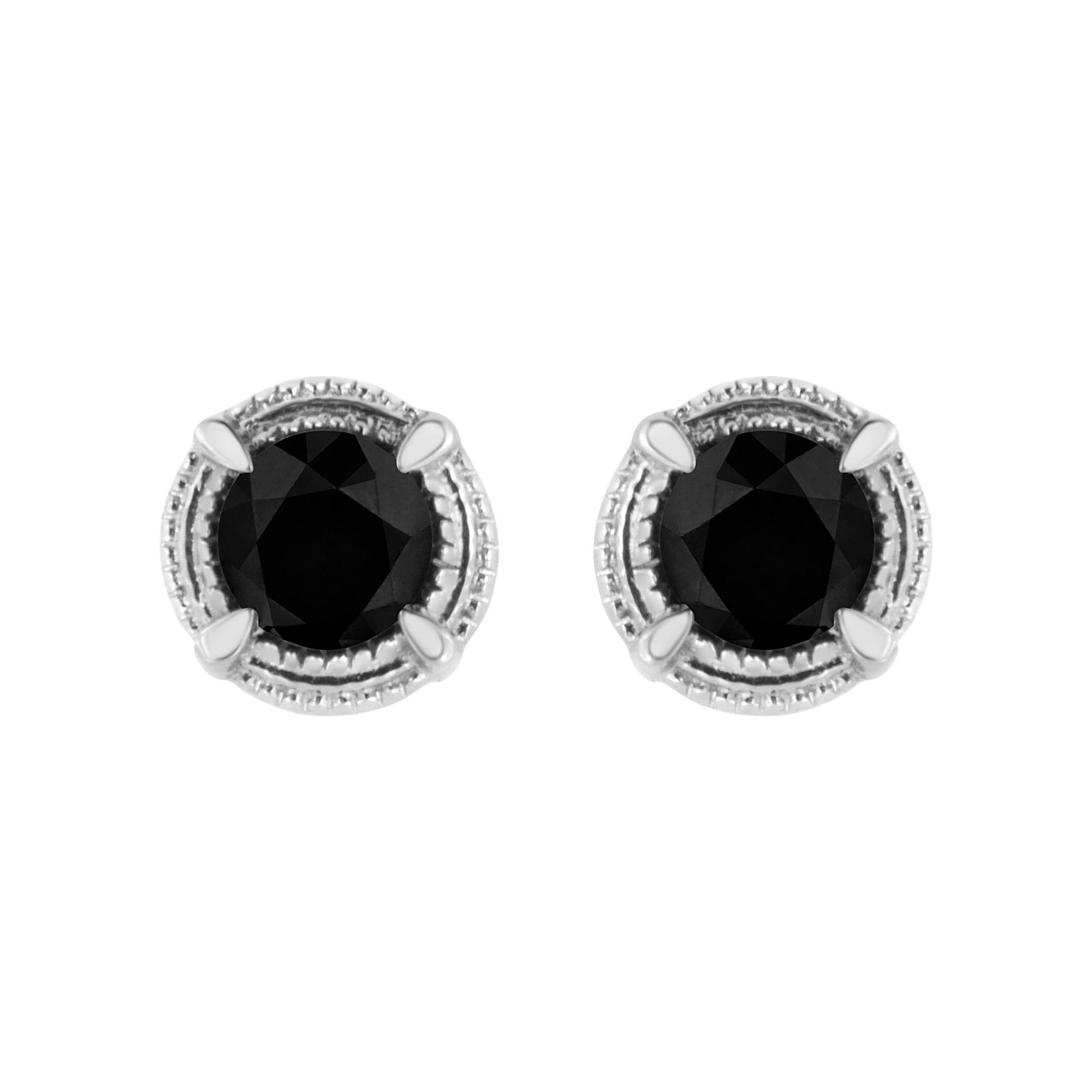 Top-down view of white metal stud earrings with round black gemstones in prong settings.