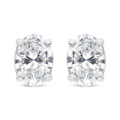 Front view of a pair of white metal earrings featuring oval-shaped white gemstones in 4-prong settings.