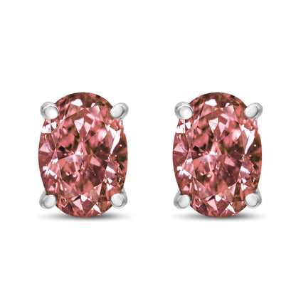 Front view of white metal stud earrings with oval-shaped pink gemstones in four-prong settings.