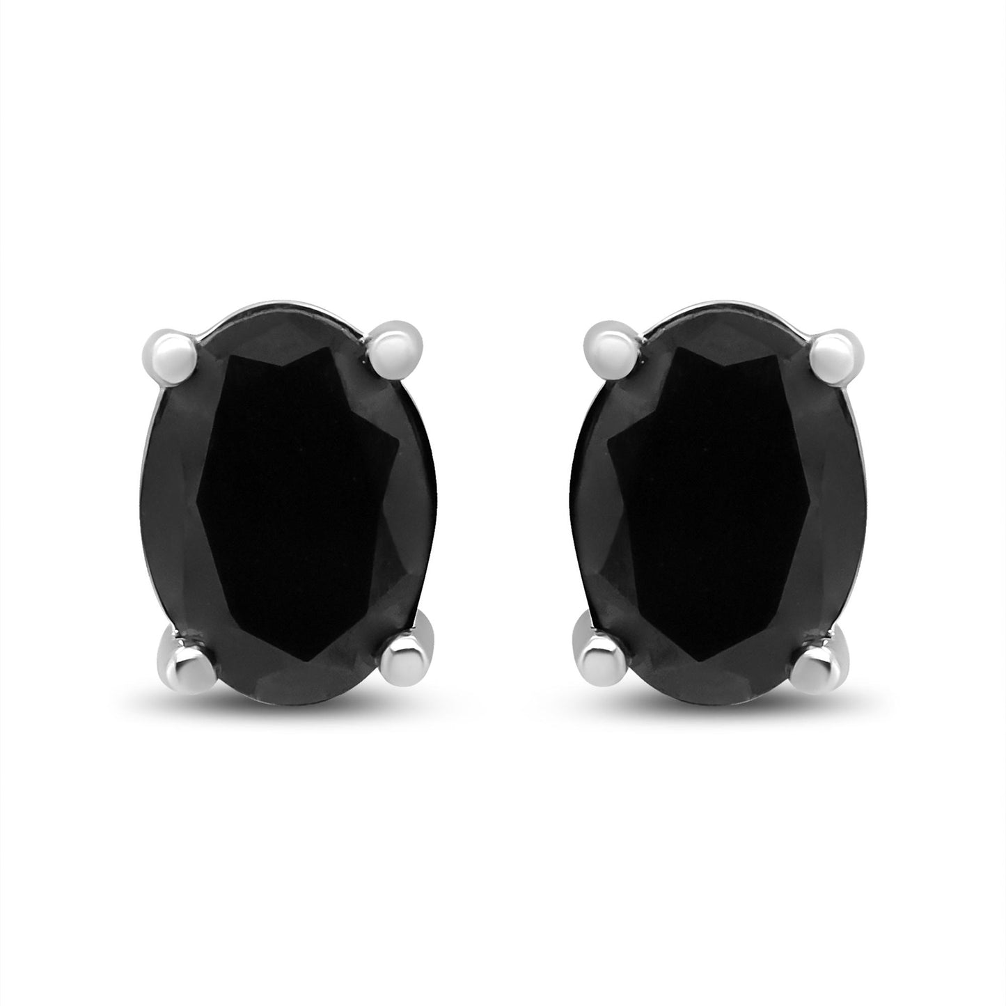 Front-facing view of white metal stud earrings featuring oval-shaped black gemstones in four-prong settings.