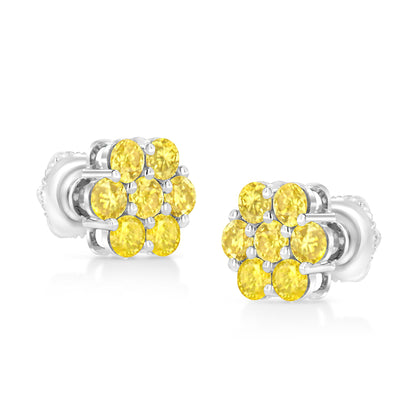 Pair of white metal stud earrings with clusters of round yellow gemstones in prong settings, shown from a slightly angled front view.