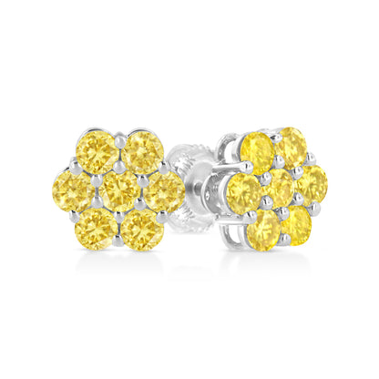 Pair of white metal stud earrings with clustered round yellow gemstones in prong settings, shown in a close-up angle.