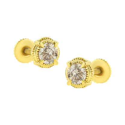 Close-up front angle of round prong-set brownish gemstones earrings in yellow metal.