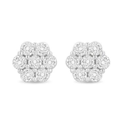 Pair of white metal cluster earrings with round white gemstones in prong settings, front-facing view.