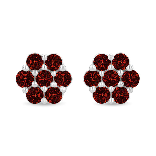 Pair of white metal earrings with round red gemstones in prong settings, front-facing shot.