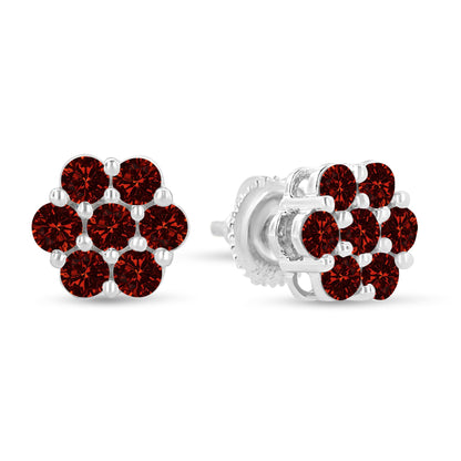 Pair of white metal stud earrings with cluster of round red gemstones in prong settings, shown from front and side angles on a white background.