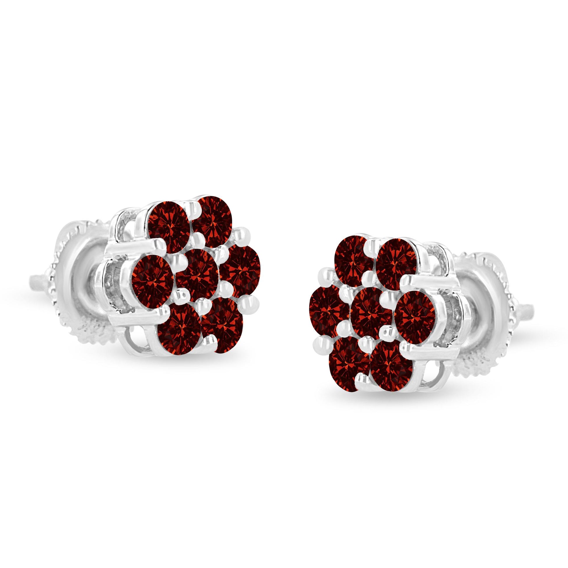 Pair of white metal stud earrings with multiple round red gemstones in prong settings, shown in a close-up front angle.