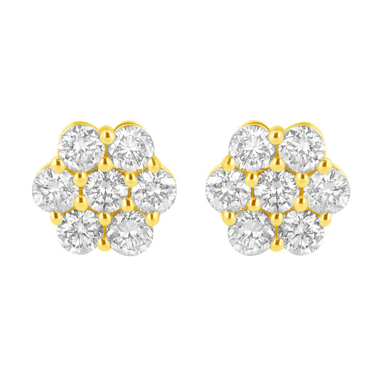 Front-facing close-up of a pair of yellow metal earrings designed with multiple round white gemstones in prong settings forming a clustered pattern.