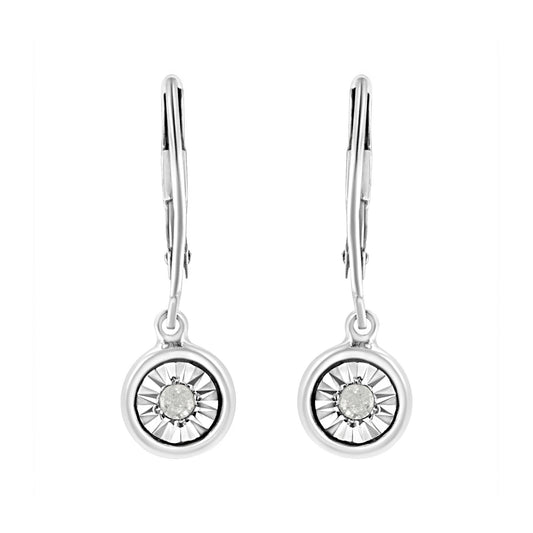 Front view of white metal drop earrings with round white gemstones set in a circular design.