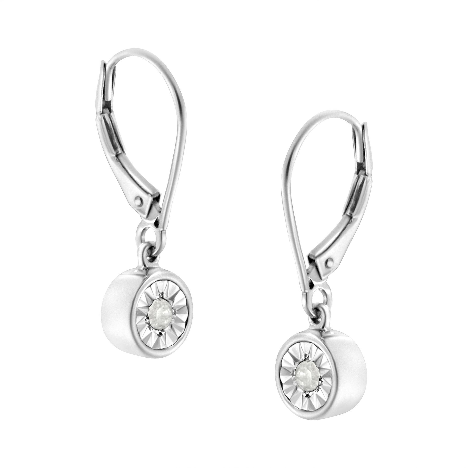 White metal drop earrings with round white gemstones in miracle settings, shown in a front angle view.
