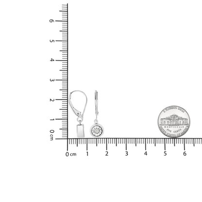 White metal round-shaped earrings with miracle setting white gemstones, displayed side by side on a ruler for size reference, shown from front and side angles.