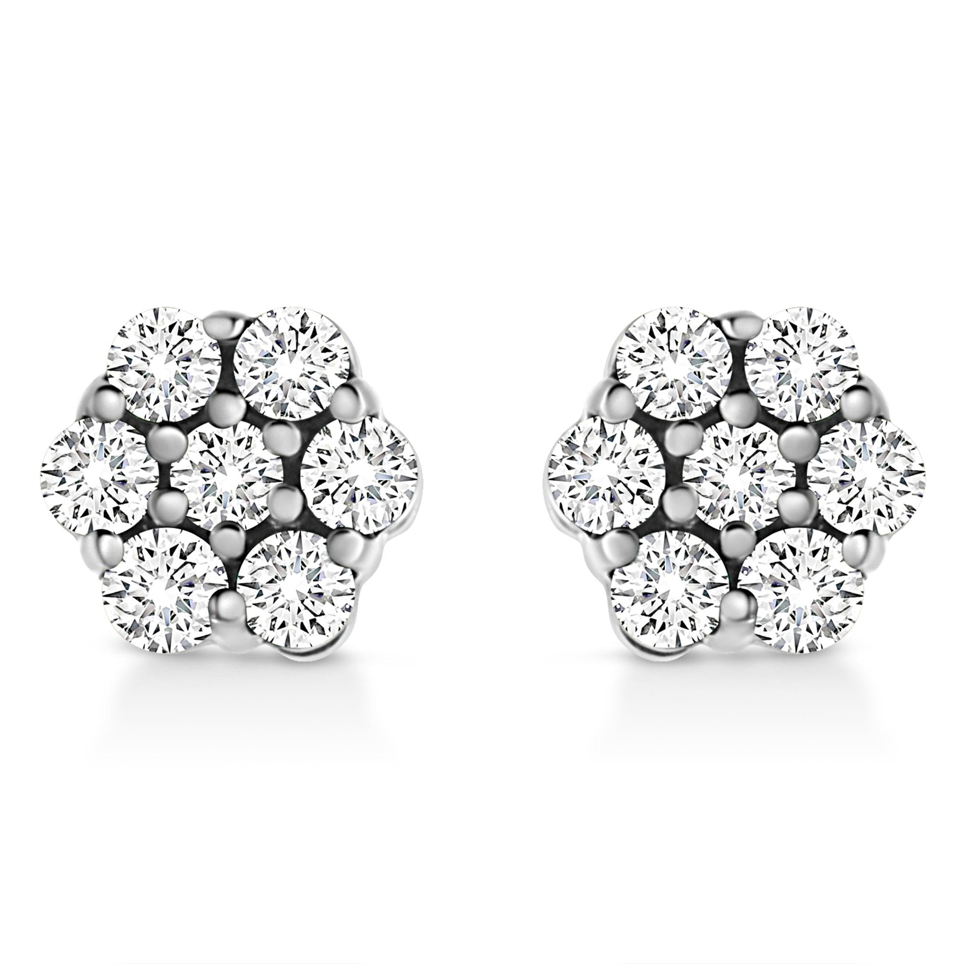 Front angle view of a pair of white metal earrings with round white gemstones in a cluster prong setting.