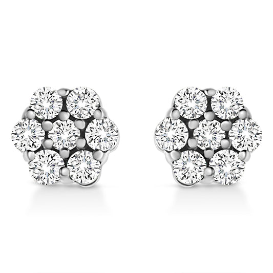 Front angle view of a pair of white metal earrings with round white gemstones in a cluster prong setting.