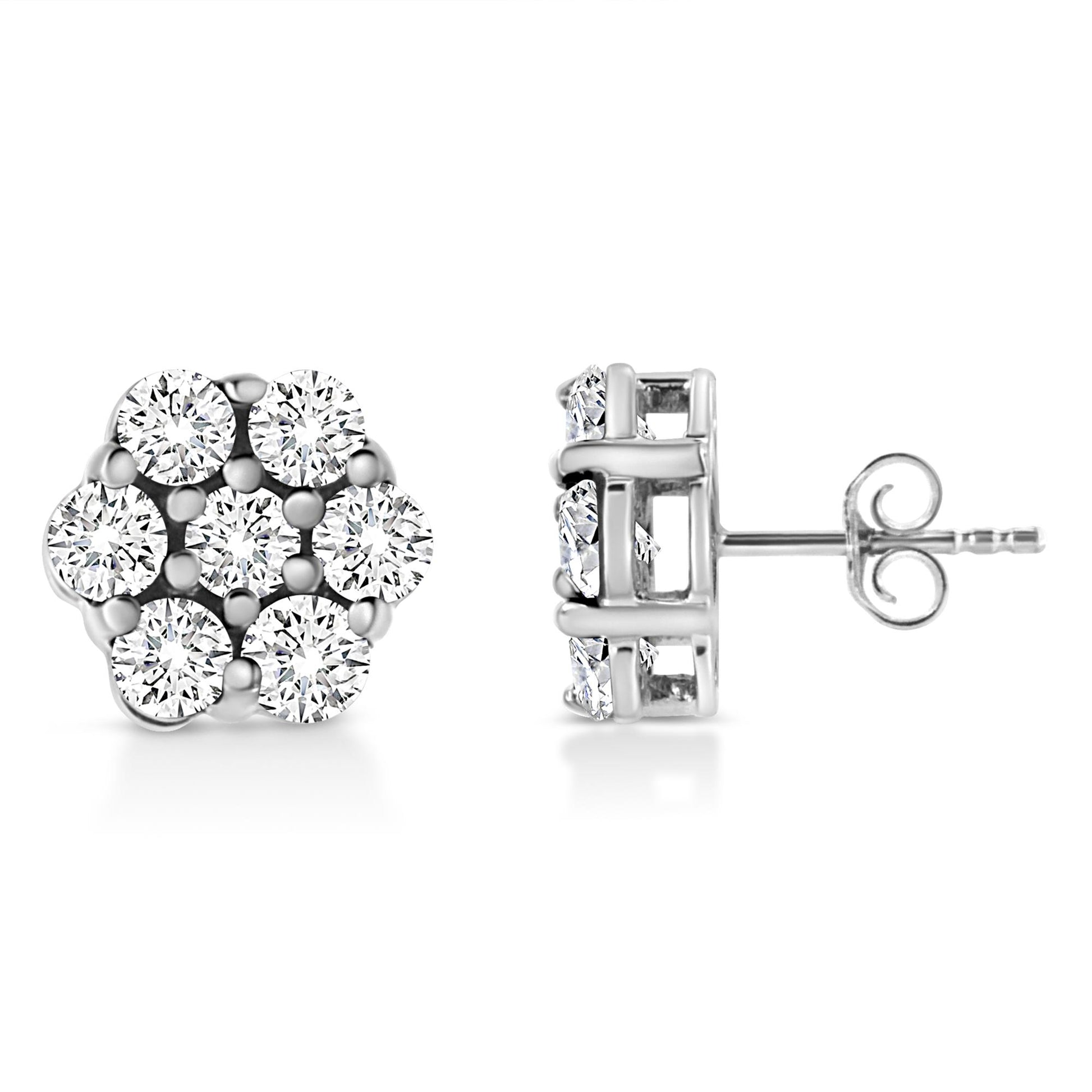 Pair of white metal stud earrings with round white gemstones in prong settings, shown from front and side angles.