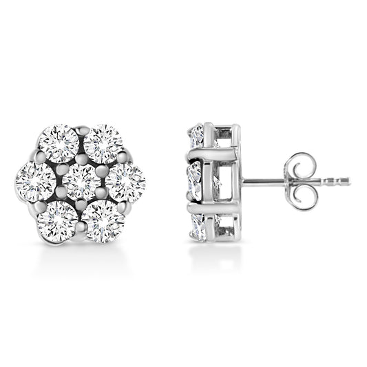 Pair of white metal stud earrings with round white gemstones in prong settings, shown from front and side angles.