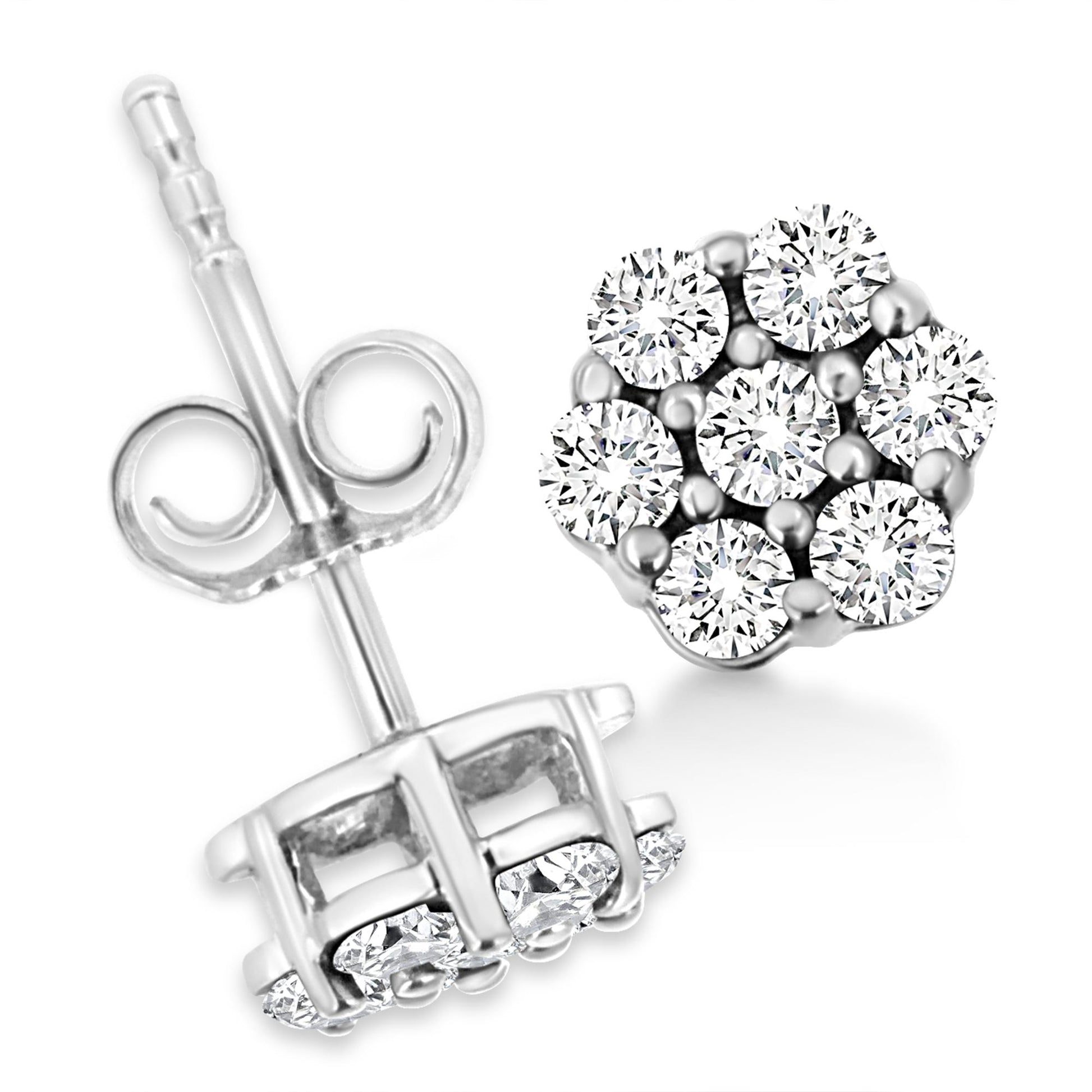 Close-up front and back view of white metal stud earrings with round white gemstones in prong settings.