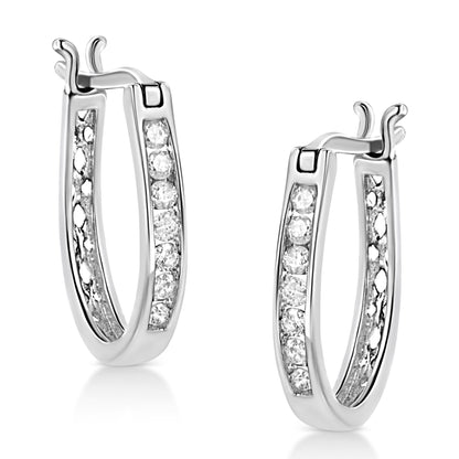 Pair of white metal hoop earrings with channel-set round white gemstones, shown from a slightly angled front view.