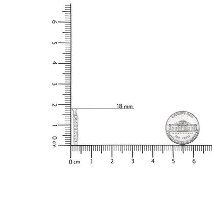Earrings with white metal and round white gemstones in channel setting, displayed vertically next to ruler and coin for size reference, shot from the front.