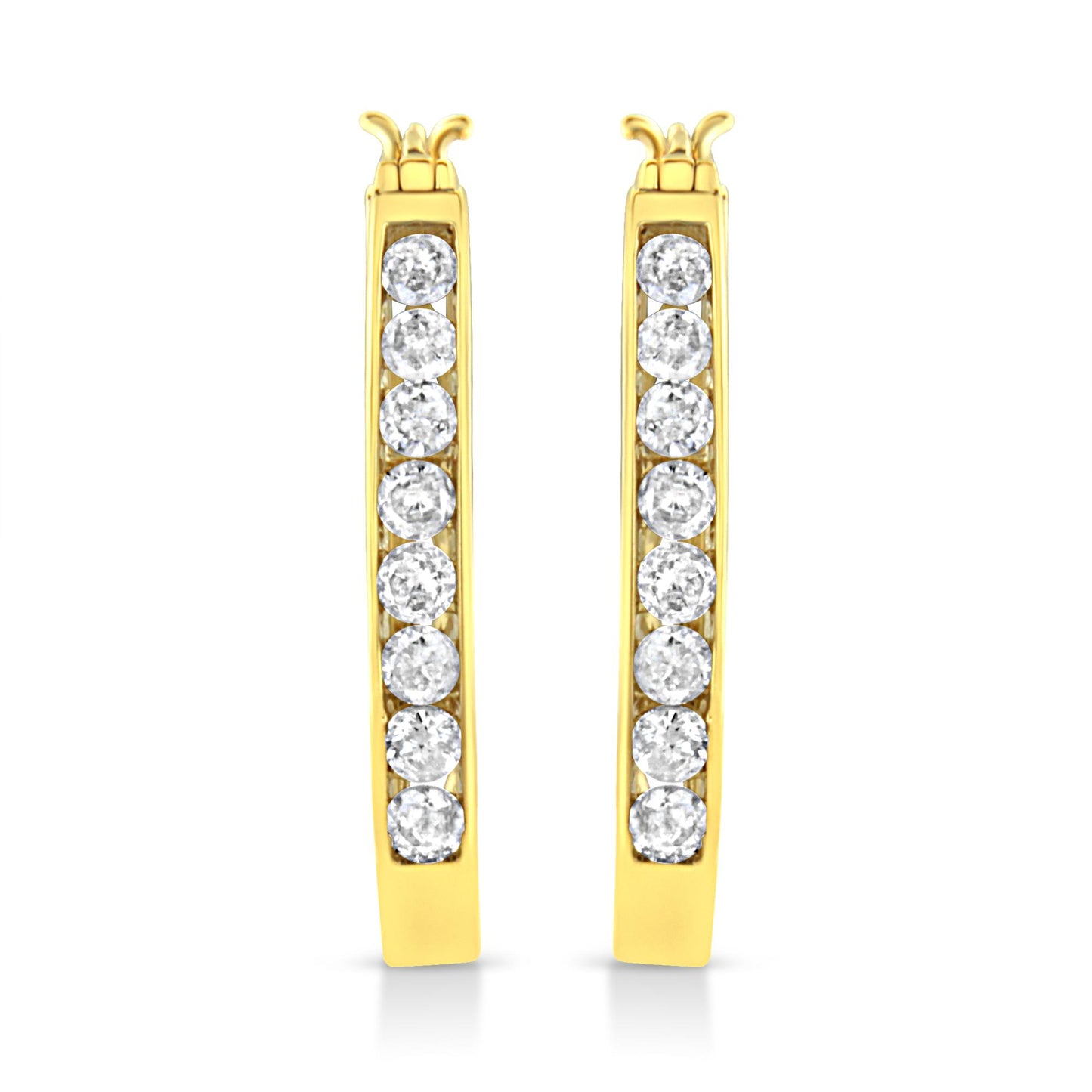 Front-facing view of a pair of yellow metal hoop earrings with a vertical row of round white gemstones set in a channel setting.