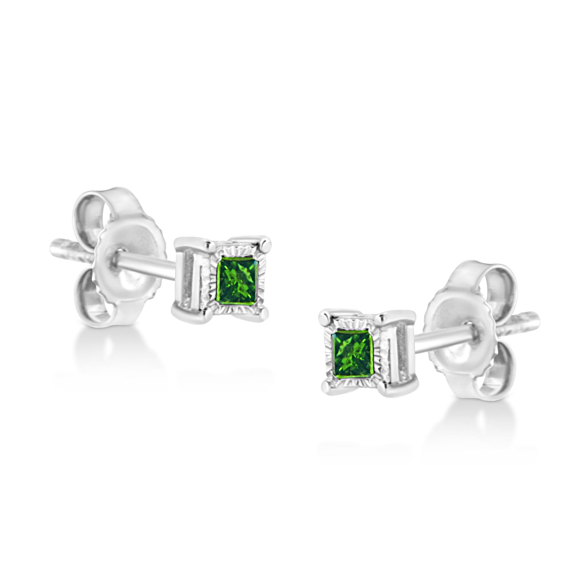 Pair of white metal stud earrings with square green gemstones in a miracle setting, shown in a close-up side angle.