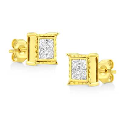 Pair of yellow metal stud earrings with four princess-shaped white gemstones in an invisible setting, shown in a close-up angled view.