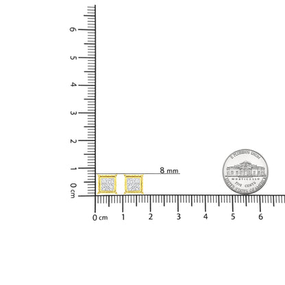 Front angle of square yellow metal stud earrings with white princess shape gemstones, shown on a ruler and next to a coin for size reference.