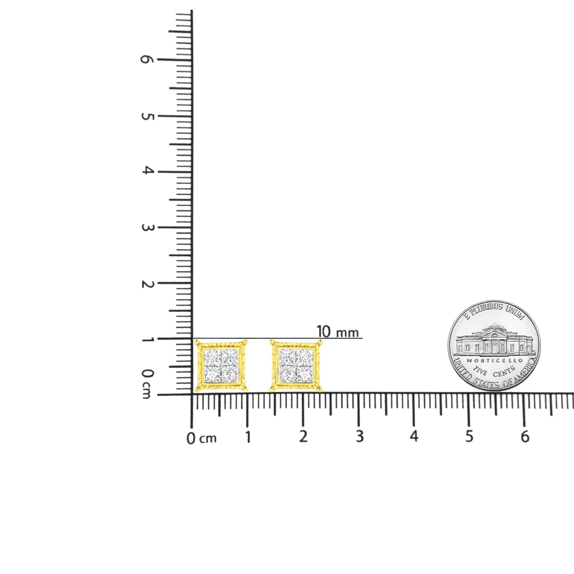 Pair of yellow metal square earrings with white gemstones in invisible setting, shown from front on a ruler and next to a coin for size reference.