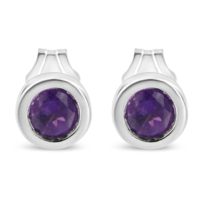 Front view of white metal earrings featuring round purple gemstones in bezel settings.