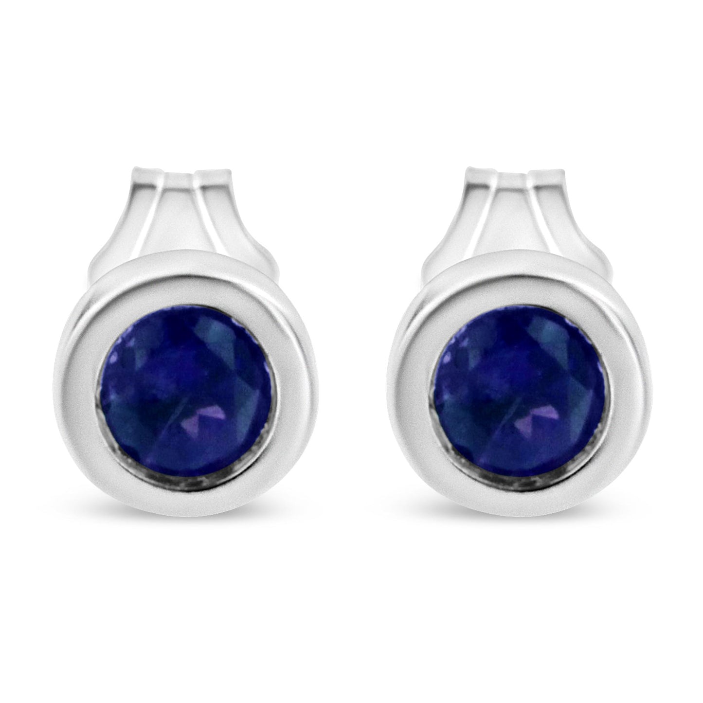 Front view of a pair of white metal stud earrings each featuring a round blue gemstone in a bezel setting.