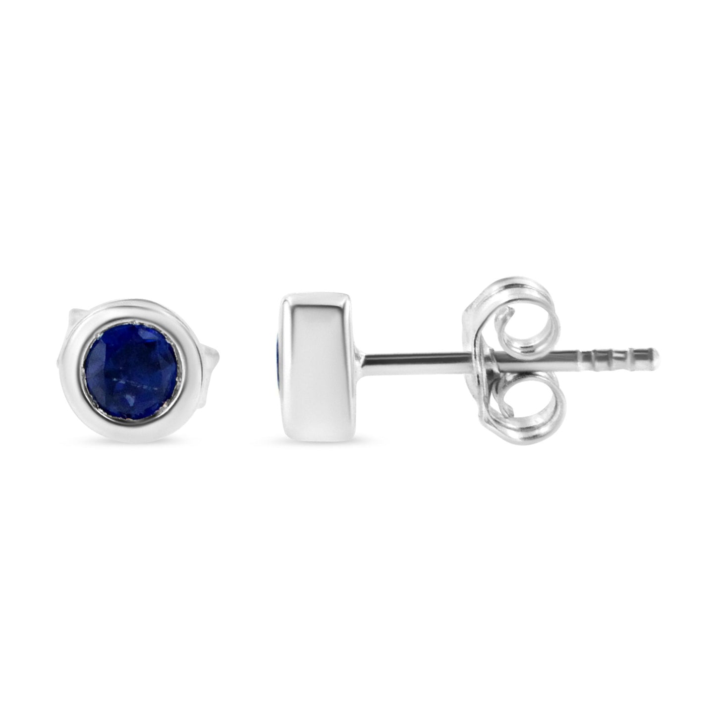 Pair of white metal stud earrings with round blue gemstones in bezel settings, shown from front and side angles.