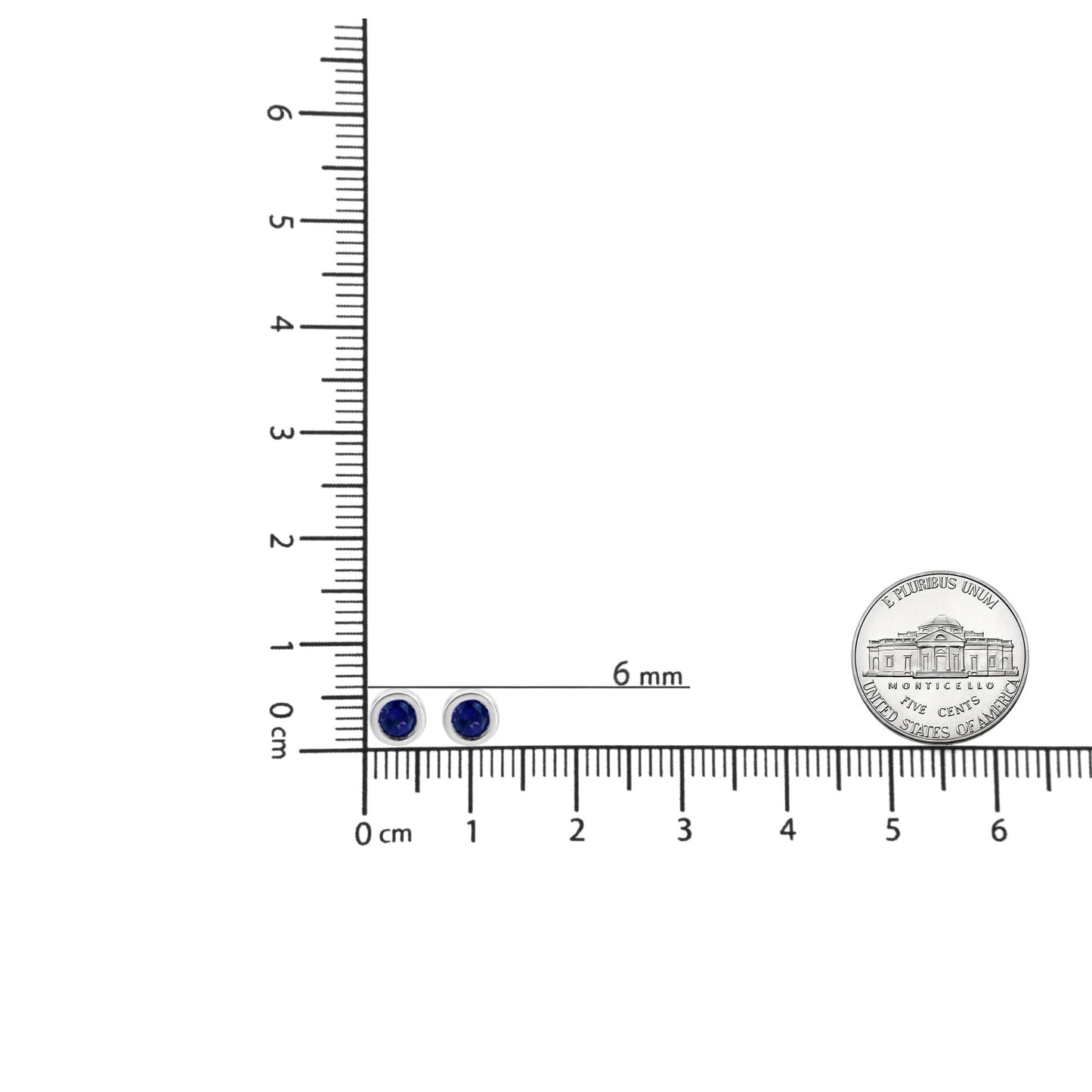 Top-down view of white metal round blue gemstone bezel-set stud earrings placed on a ruler for size reference with a coin nearby.