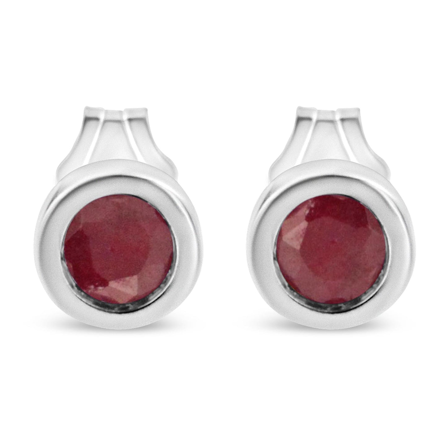 Front view of white metal round bezel-set red gemstone earrings.