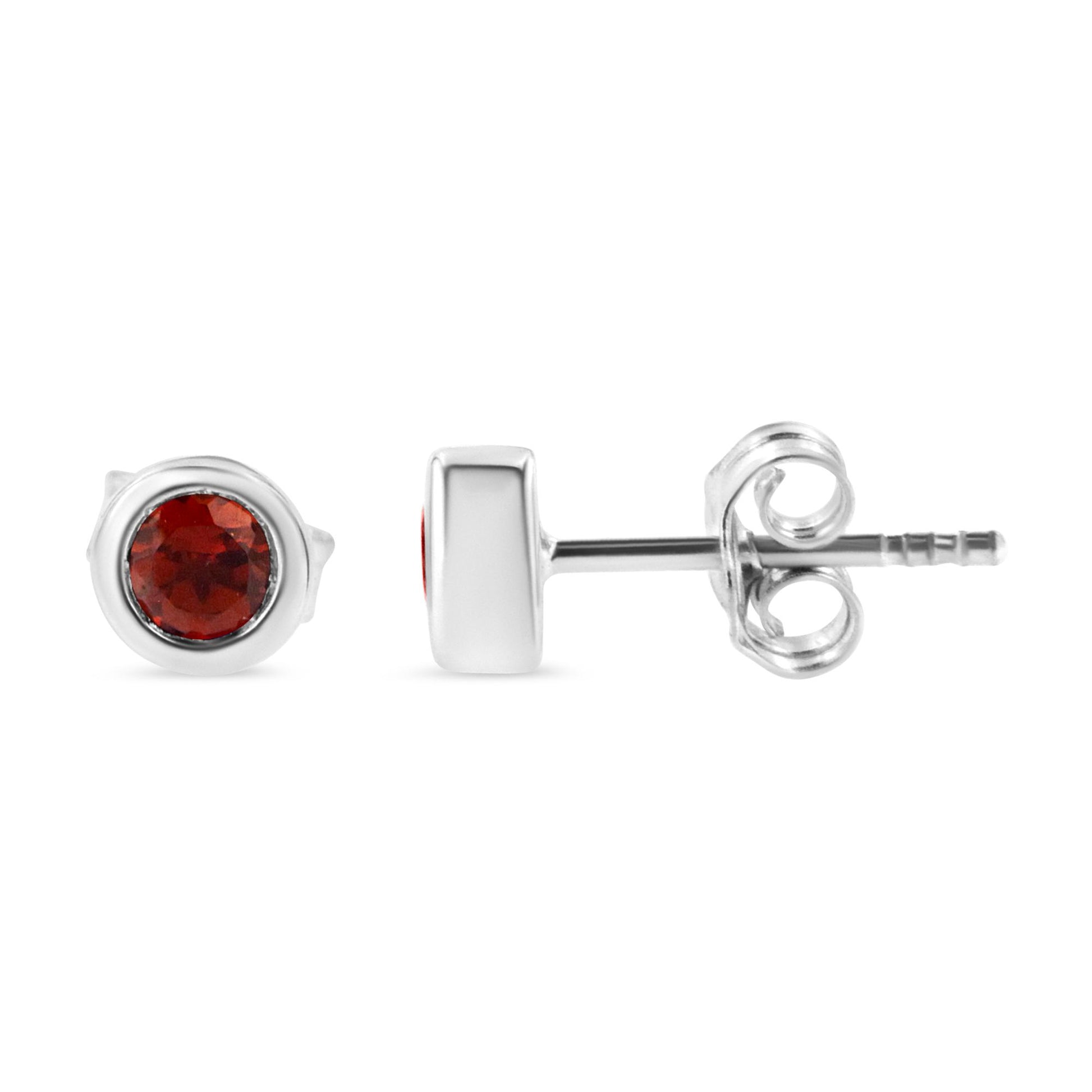 Pair of white metal stud earrings with round red gemstones in bezel settings, shown from front and side angles on a white background.