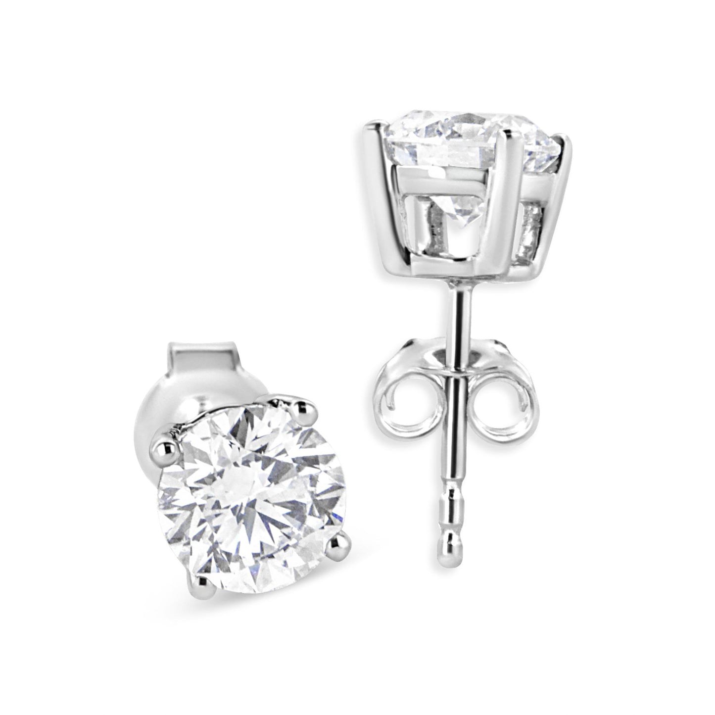 Close-up front and side angle view of a pair of white metal stud earrings with round white gemstones in four-prong settings.