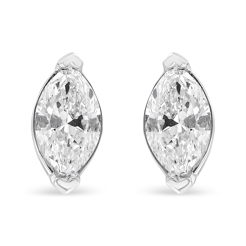 Front-facing pair of white metal marquise shaped earrings with white gemstones in prong settings.