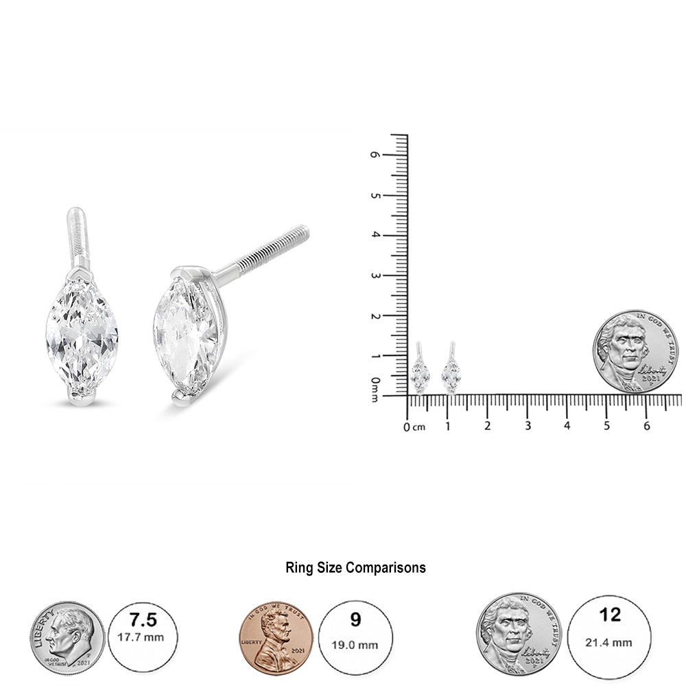 Pair of white metal earrings with marquise-shaped white gemstones set in a 2-prong setting, shown from a front and side angle next to a ruler for size reference.