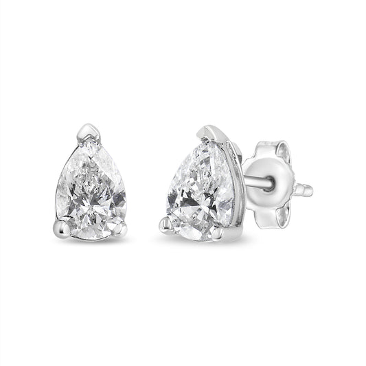 Front and side angle view of white metal stud earrings with pear-shaped white gemstones in 3-prong settings.