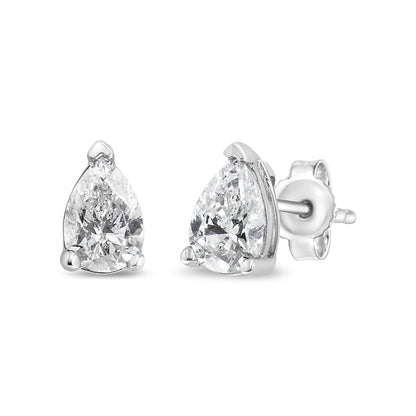 Front angled view of white metal stud earrings featuring pear-shaped white gemstones in 3-prong settings.