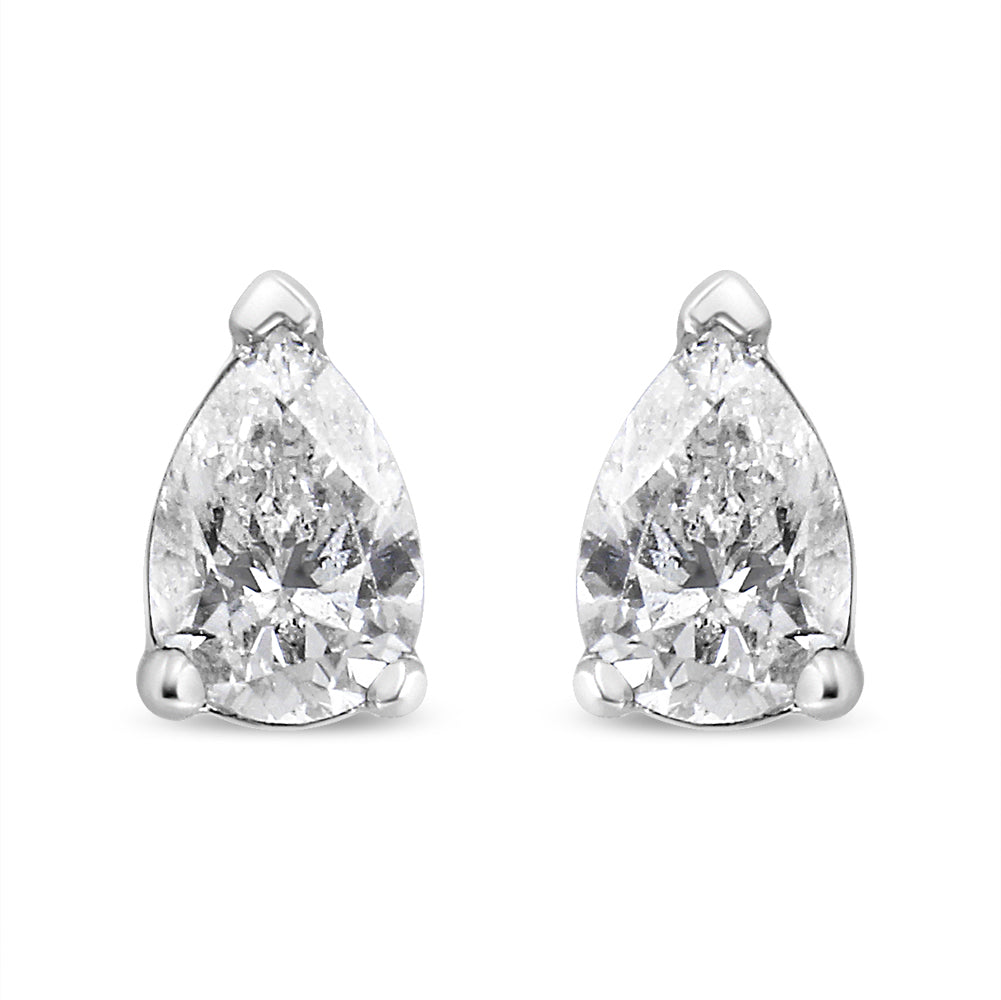 Front view of a pair of white metal pear shape stud earrings with white gemstones in 3-prong settings.